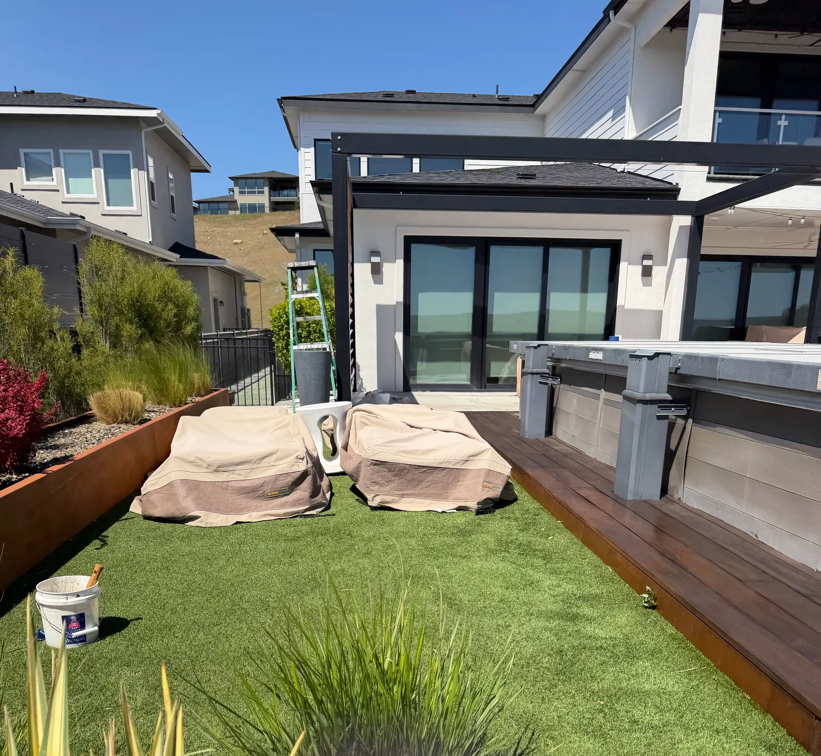 Dark-stained wood deck beside planter boxes in a modern Star, Idaho backyard