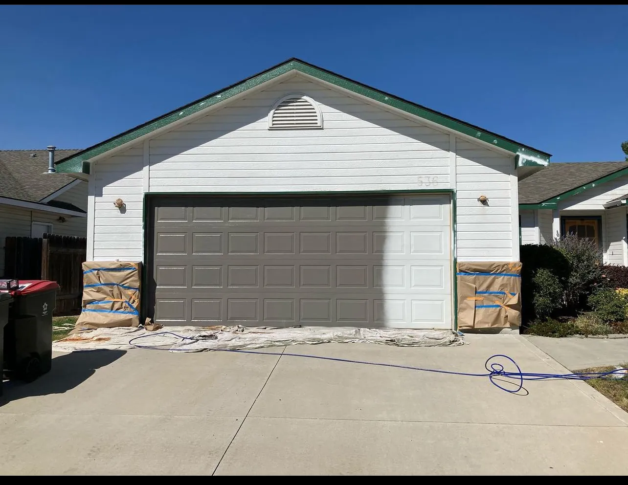 Garage door spraying by Glenn Painting Co